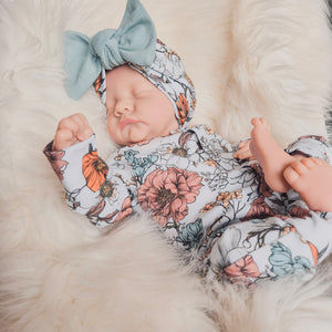floral printed baby grow with matching bow hat
