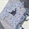 loose-fit Monosplatter tee with dipped hem. Ethically made in the UK, perfect for summer play.