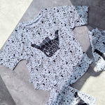 loose-fit Monosplatter tee with dipped hem. Ethically made in the UK, perfect for summer play.