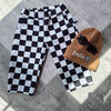 Baggy toddler trousers in black and white chefs checks fabric