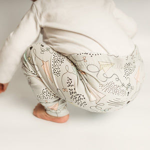 Unisex baby and toddler leggings by Lottie & Lysh. Paper plane and cloud print design