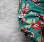 Close up of the Lottie & Lysh branding label on cherubs print babygrow