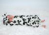 newborn baby girl wearing a bow print baby romper with matching headband by Lottie & Lysh
