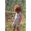 red haired little girl wearing a vintage floral playsuit handmade by Lottie & Lysh