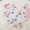 New baby gift set comprising a romper, blanket and headband made with Lottie & lysh's Welcome to the world fabric which is white with black writing. The gift is accented with baby pink
