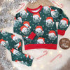 Children's christmas leggings and top set. The set is a green fabric featuring a special festive edition of Lottie & lysh's signature Lion print wearing a santa christmas hat. The set is pictured against a white fluffy background with silver tinsel, candy canes and fairy lights.