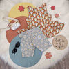 kids outfit featuring a rainbow print vest and daisy shorts
