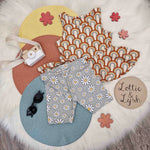 kids outfit featuring a rainbow print vest and daisy shorts