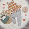 Kid's flay lay image featuring lottie and lysh daisy leggings and retro rainbows peplum vest