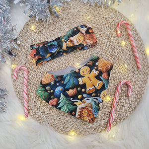 babies bandana bib and matching headband both featuring a festive gingerbread print