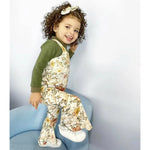 Toddler girl wearing retro flared jumpsuit by Lottie & Lysh