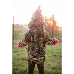 pink and green dinosaur jacket