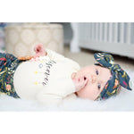 Autumn glow baby leggings and matching bow set worn by a baby girl